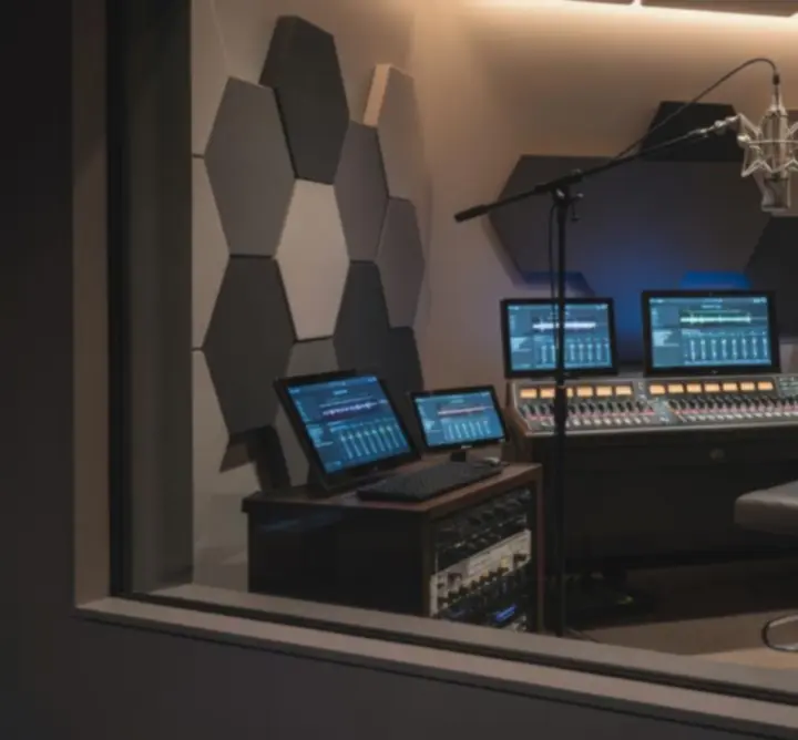 Modern recording studio setup with mixing console and high‑end monitors